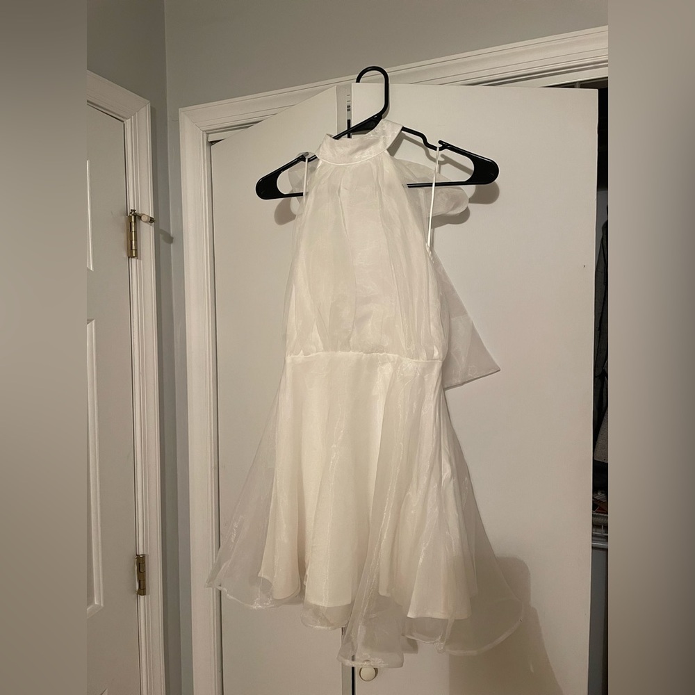 White halter dress with bow tie in back worn for engagement party